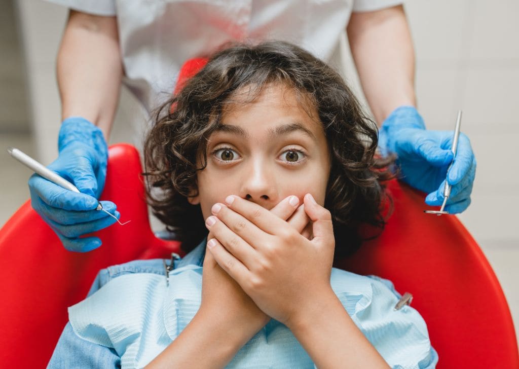 What Is Dental Anxiety and Anxiety? Why Do So Many Malaysians Have It? 1 A child having dental fear and anxiety during checkup.