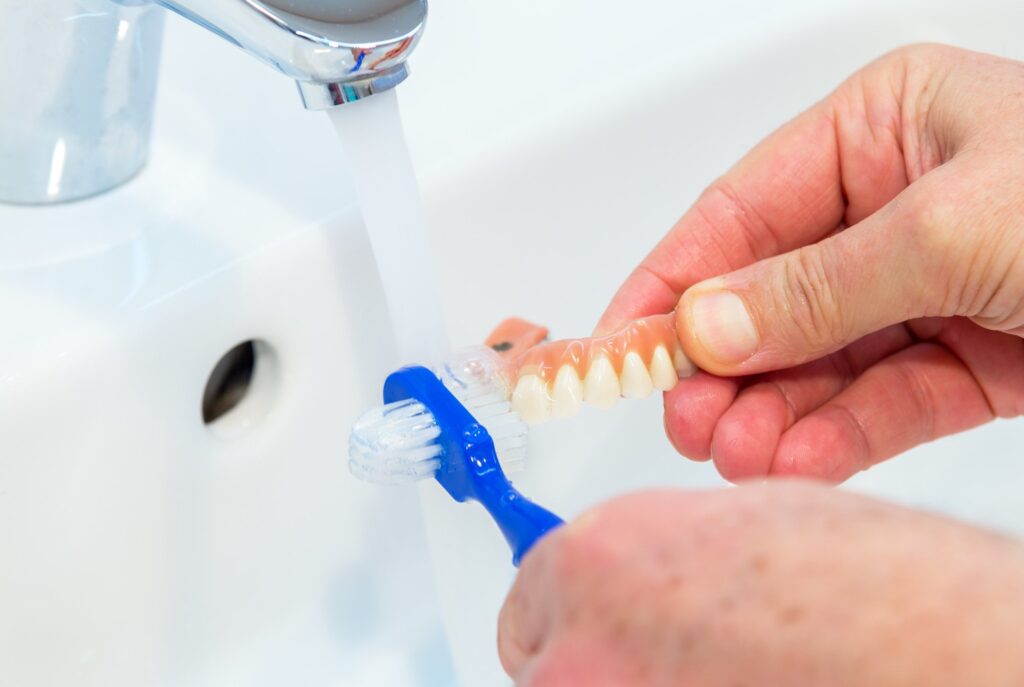 Want Your Dentures to Last? Here's the Right Way to Care for Them 7 denture cleaning