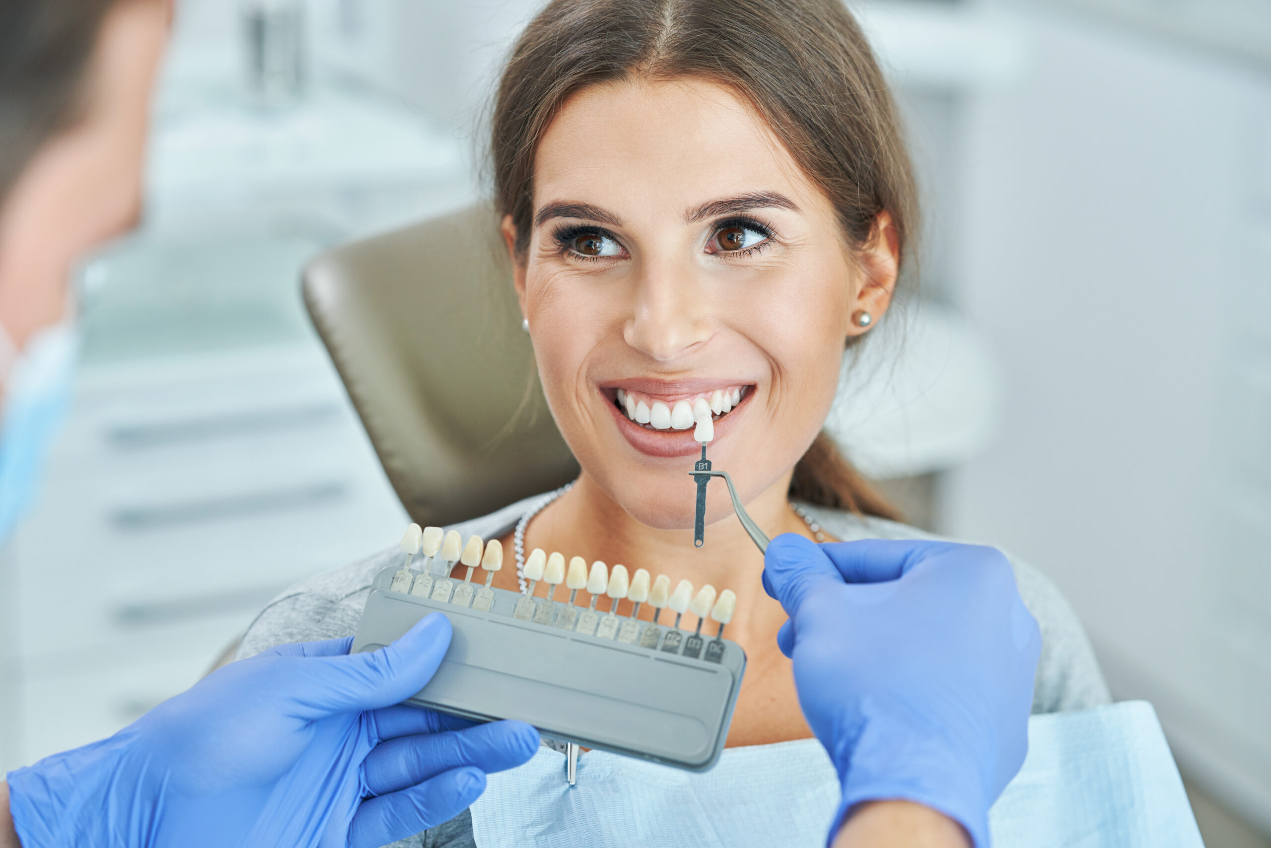 female choosing her veneers